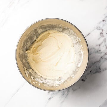 Vanilla frosting in mixing bowl.