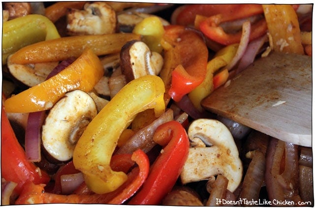 Mixed Vegetable Fajitas!! Have a fajita party in your own home. This quick and easy vegan fajita recipe can be customized however you like with endless topping options. Serve the sizzling skillet directly to the table with all the sides and everyone can make their own fajitas to their own tastes preferences. A great summer meal for family or dinner parties. #itdoesnttastelikechicken #veganrecipe #fajitas