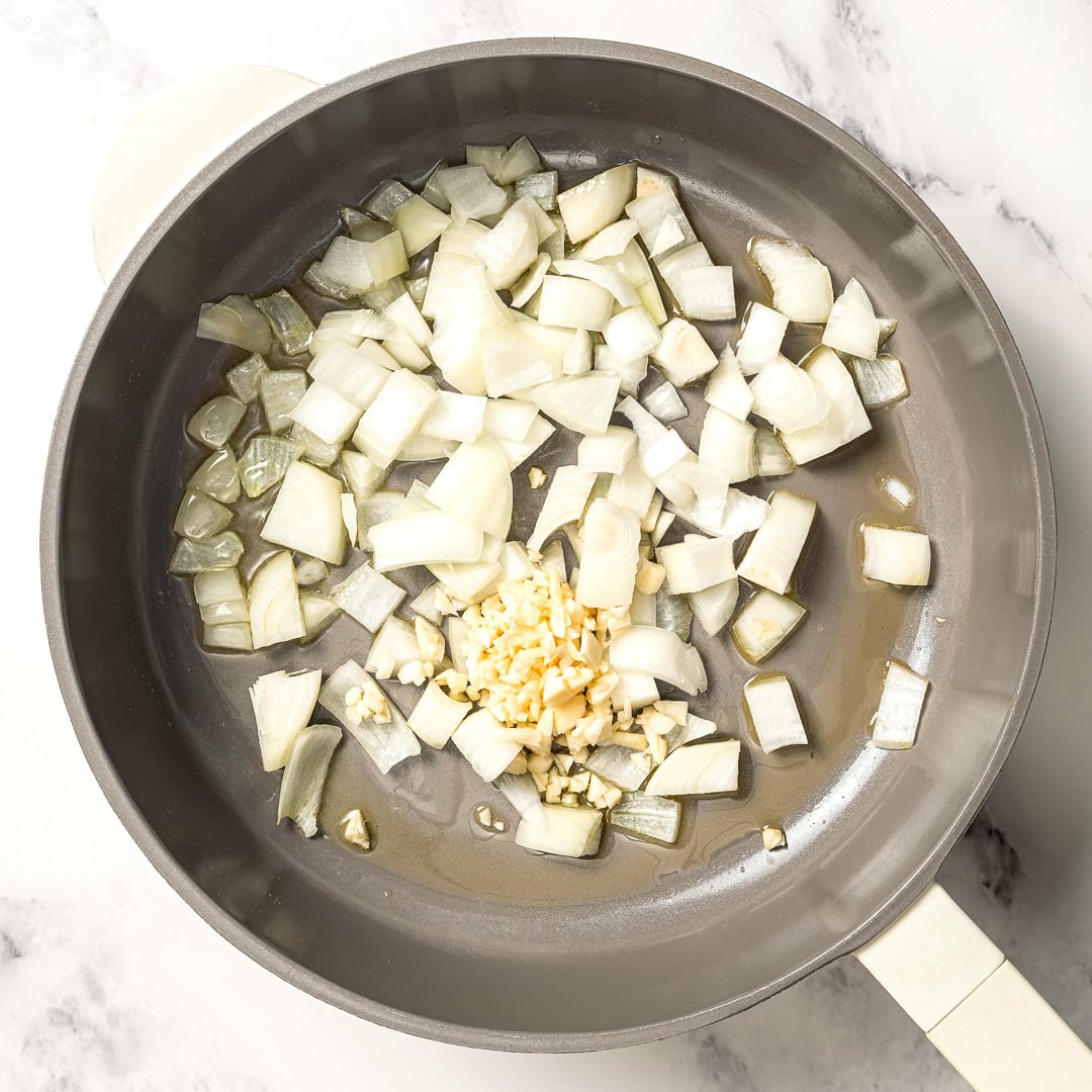 Onions cooking in skillet.
