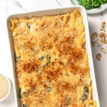 Golden breadcrumb coated spinach artichoke pasta bake.