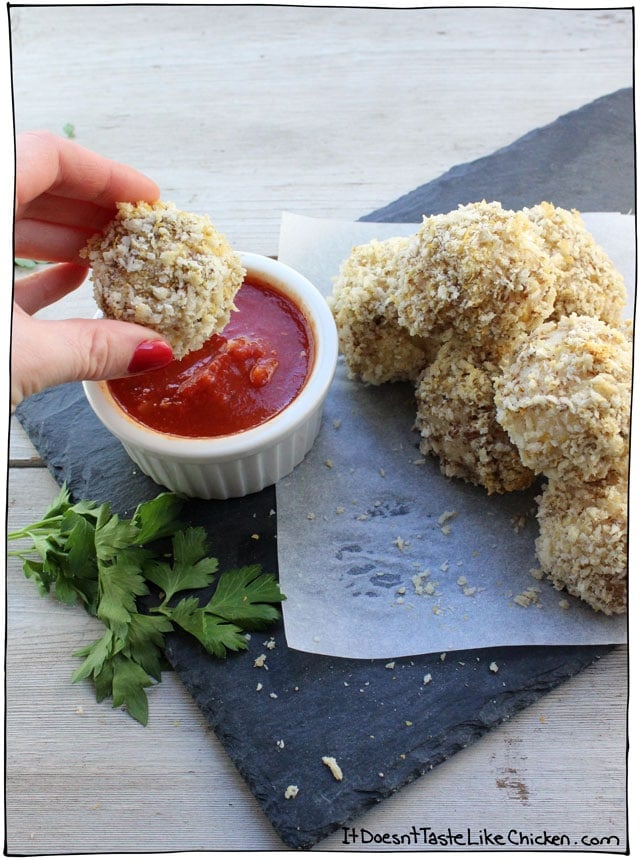 Crispy Rice Balls with Vegan Cheese! This is an easy take on the classic Italian appetizer arancini. The recipe includes a DIY mozzarella which only takes 15 minutes to make. Dip these crispy rice balls into your favourite marinara sauce. Perfect for parties! #itdoesnttastelikechicken