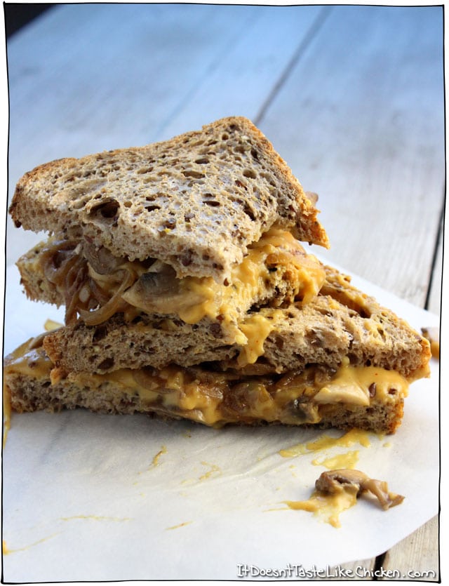 Vegan Caramelized Onion & Mushroom Grilled Cheese! Yes this is vegan, and yes this is insanely delicious! Comfort food that's healthy! Yes please. Make this dairy free nacho cheese in just 15 minutes, sauté up some onions and mushrooms, layer them on the bread, and grill to perfect. So easy and so unbelievably good. #itdoesnttastelikechicken