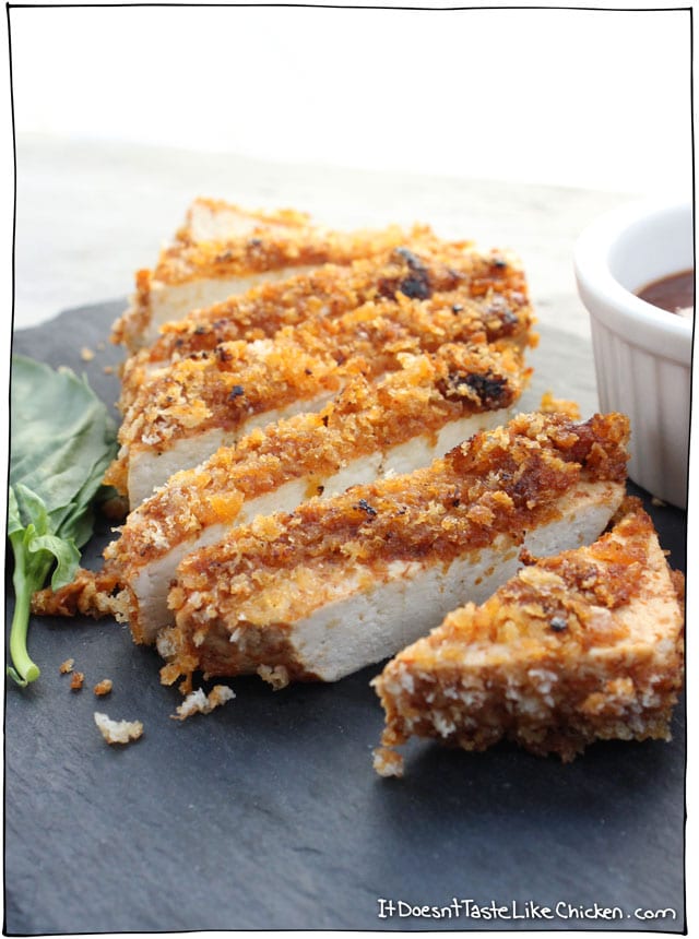 Crispy Breaded Tofu Steaks! Moist and tender tofu, zingy tomato marinade, with a crispy breadcrumb coating. A quick and easy recipe that is perfect for serving with potatoes and veg. Gluten free option. #itdoesnttastelikechicken