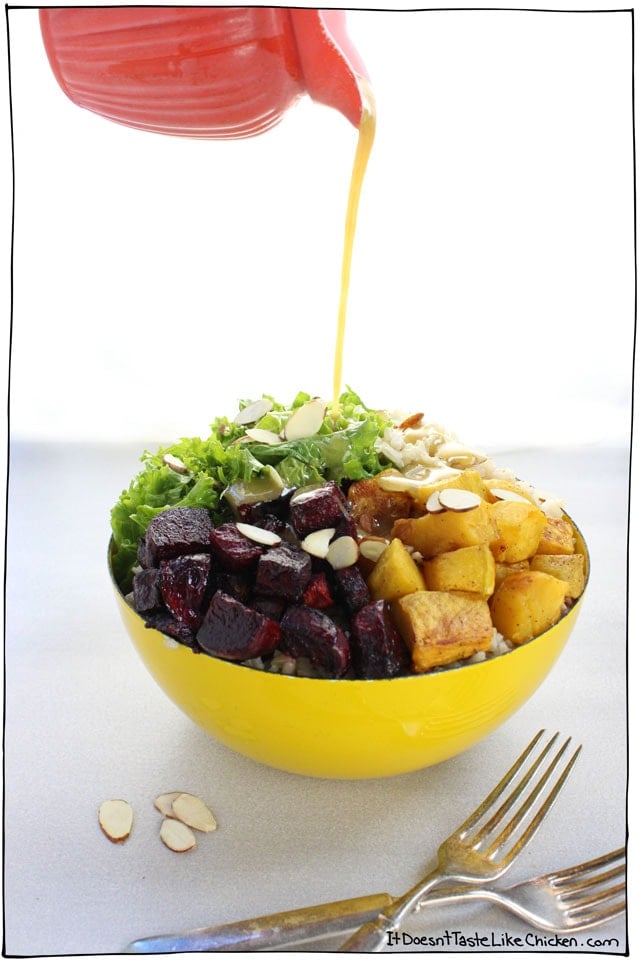 Beet, Squash & Kale Autumn Bowl! Sweet roasted beets, tender squash, and zesty kale on a bed of brown rice, all drizzled with maple mustard dressing. Vegan and gluten free Buddha bowl. #itdoesnttastelikechicken