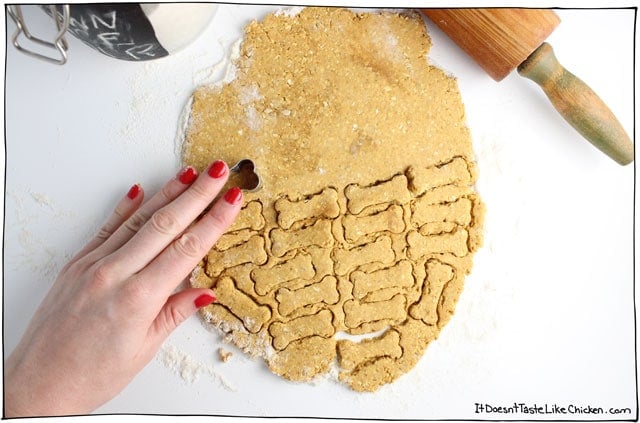 Use a cookie cutter or just a knife to cut the dough into homemade dog treats.