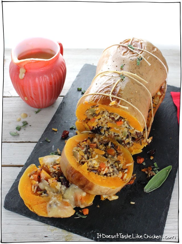 Stuffed Roasted Butternut Squash! The perfect vegan centrepiece main dish for Thanksgiving, Christmas, or any holiday. Stuffed with super flavourful wild rice, cranberries, walnuts, and sage filling. Can be made up to 3 days ahead of time and warmed up before serving. Gluten free, vegan, vegetarian, dairy free. #itdoesnttastelikechicken