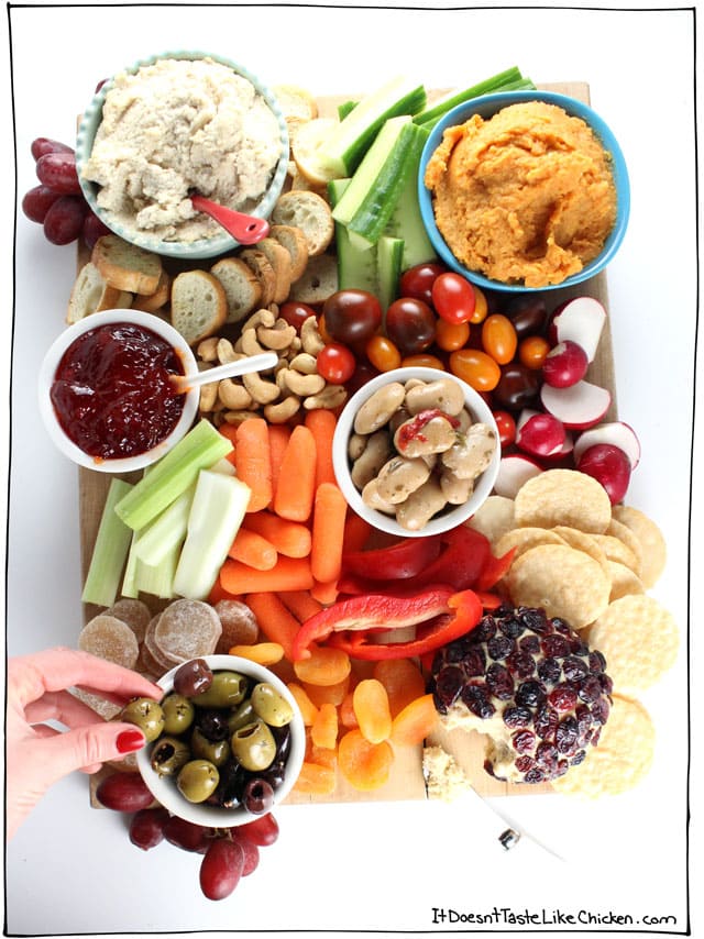 Cheese board shmeeze board. Spice up your party with this guide of How to Make a Vegan Snack Board. Homemade or store-bought, this appetizer platter is quick and easy to assemble, but is sure to impress! #itdoesnttastelikechicken