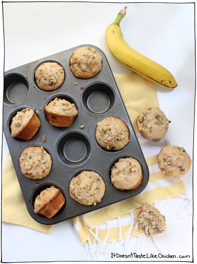 Vegan Banana Nut Muffins! Bursting with banana flavour, little pops of nut crunch, tender, lightly sweet, and gorgeously moist. Dairy-free, egg-free. #itdoesnttastelikechicken