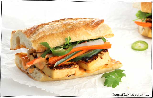 Layers of seasoned grilled tofu, a creamy spicy spread of homemade Sriracha mayonnaise, sweet salty and crunchy pickled veggies piled high, garnished with fresh cilantro and jalapeno, all on top of a soft chewy baguette. ← THIS is the king of sandwiches, and it’s called Grilled Tofu Banh Mi. #itdoesnttastelikechicken