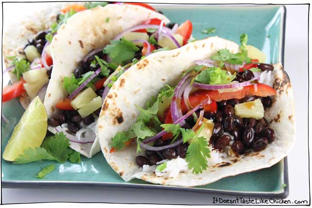 Super quick to make vegan tacos, perfect for a weeknight. Sweet, sour, and tangy flavour, hearty black beans, on a fire toasted tortilla topped with crispy red pepper, sweet pineapple, spicy red onion, and fresh cilantro. 20 Minute Teriyaki Black Bean Tacos! #itdoesnttastelikechicken