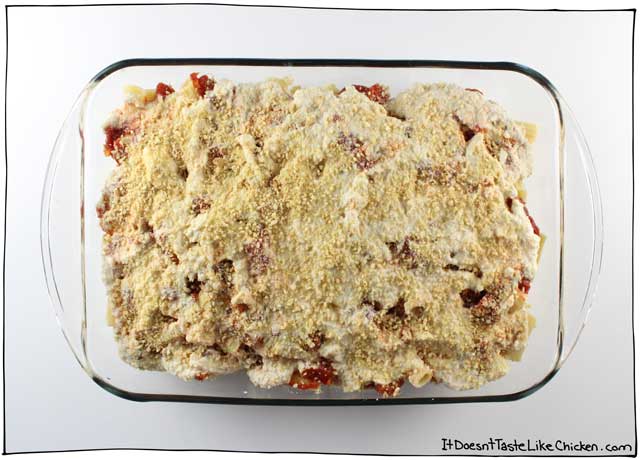 Classic Vegan Baked Ziti. This delicious pasta bake is layered with a simple homemade tomato sauce and my an easy vegan ricotta recipe. Perfect for a dinner party, special Sunday dinner, potluck, or just a night when you feel like you need to good ol’ fashioned home cooking. #itdoesnttastelikechicken