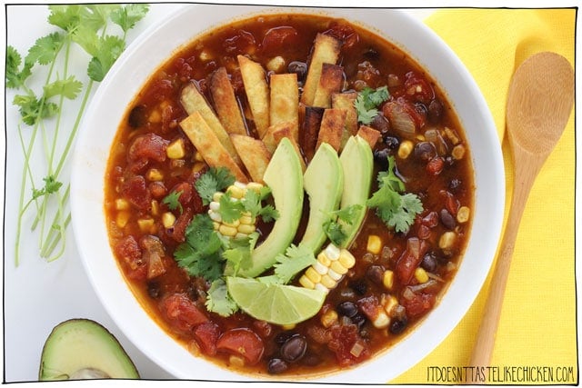 Vegan Tortilla Soup! The perfect hearty soup for a chilly night, but surprisingly easy to make. Tomatoes, hearty black beans, pops of sweet corn, seasoned to perfection with Mexican spices. Top that with crispy tortilla strips, creamy avocado, fresh cilantro, and a squeeze of zesty lime. Hello flavour! #itdoesnttastelikechicken