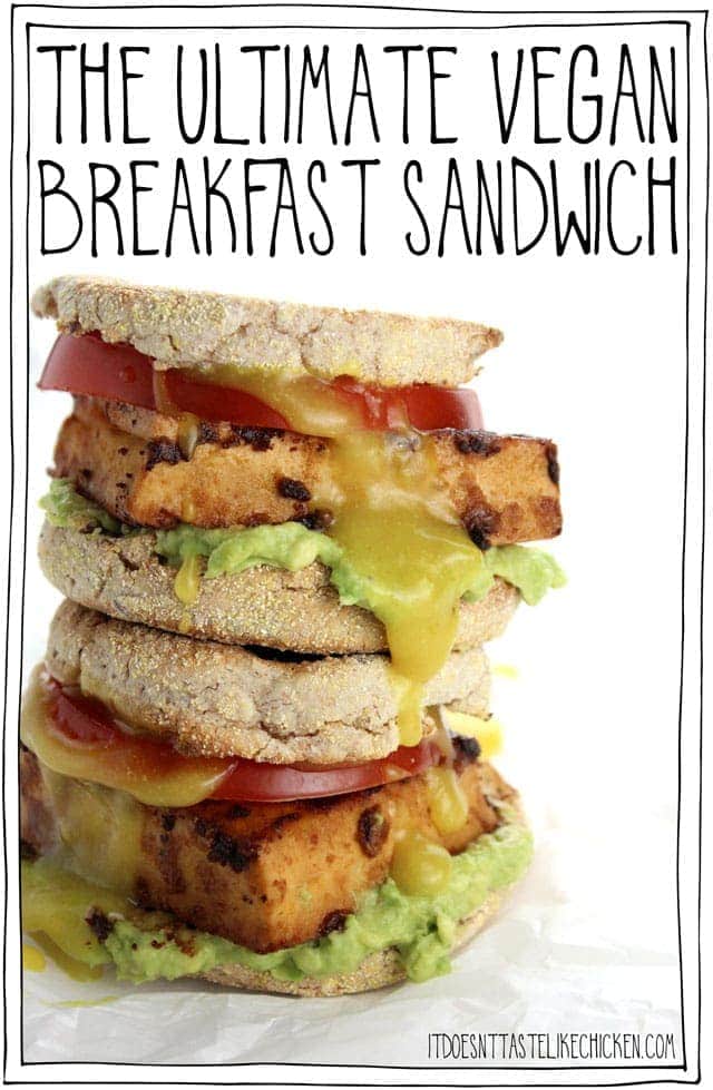 The Ultimate Vegan Breakfast Sandwich! Thick slices of smoky, marinated tofu on an English muffin with mashed avocado, a slice of ripe tomato, and a homemade 5-minute vegan egg yolk inspired sauce. The tofu gets more flavourful the longer it marinates. I just keep it marinating in the fridge, so when morning hunger strikes, it's game on! #itdoesnttastelikechicken #veganrecipes #veganbreakfast #eggfree