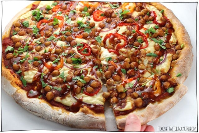 Vegan BBQ Chickpea Pizza! Made with a homemade vegan mozzarella that only takes 15 minutes to make. Layered with spicy and smoky BBQ chickpeas for the ultimate hearty cheeseless pizza. Dairy-free, gluten-free, oil-free, plant-based. #itdoesnttastelikechicken #veganpizza #veganrecipes #vegancheese