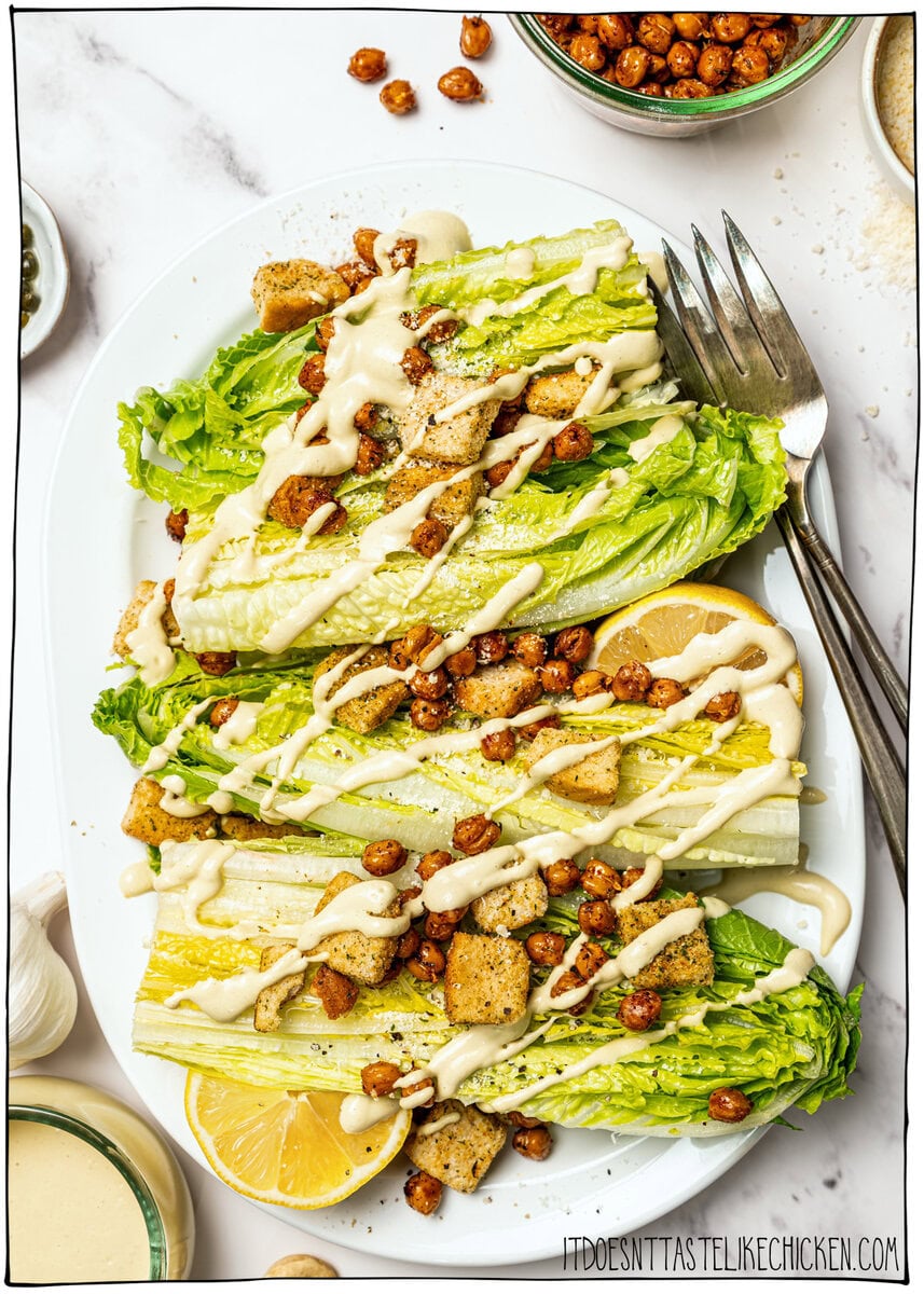 Vegan caesar salad sprinkled with golden crispy roasted chickpeas.