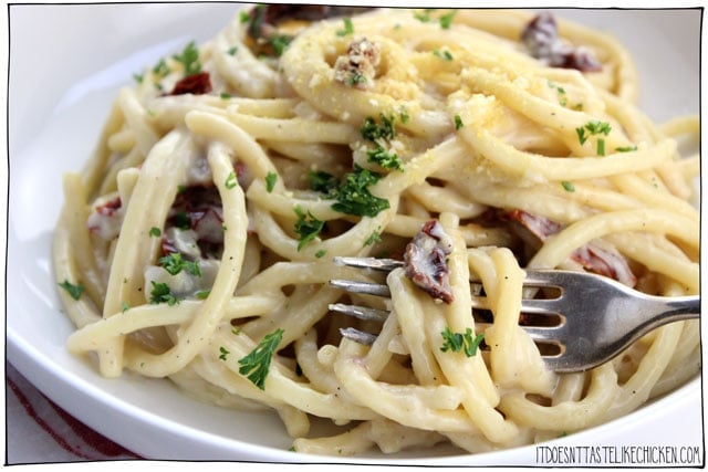 Fast and Easy Vegan Carbonara! This 20-minute pasta recipe is so easy to whip together. A simple creamy sauce coats the noodles with chewy, salty, smoky, bites of sun-dried tomato. Perfect for a busy weeknight meal, made from ingredients you probably already have in the pantry. Egg-free, dairy-free. #itdoesnttastelikechicken #veganrecipe #veganpasta