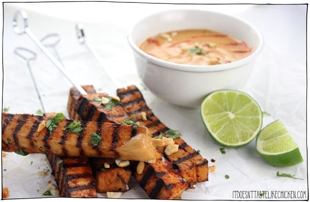 Grilled Tofu Skewers with Spicy Peanut Sauce! The tofu can marinate in the fridge for up to 3 days, then just grill on your BBQ when ready to enjoy. These also work great as a party appetizer. #itdoesnttastelikechicken #veganrecipes #veganbbq #tofurecipe
