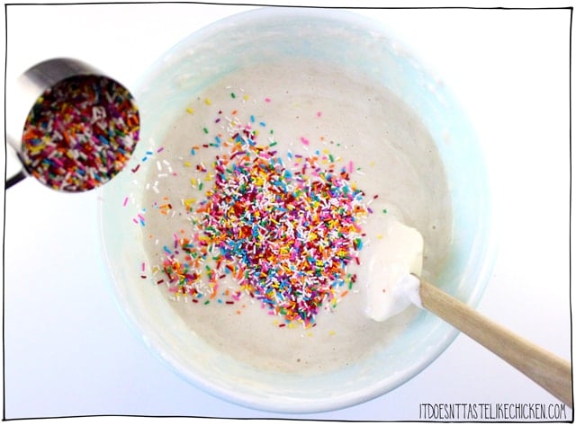 Vegan Confetti Cake! A delicious vanilla cake with sprinkles stirred into the batter to make spots of bright color throughout. Perfect for a vegan birthday cake! Deliciously moist and sweet, this rainbow cake is perfect for a birthday party. #itdoesnttastelikechicken #veganrecipes #vegandesserts #vegancake