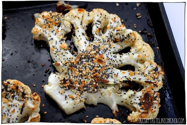 These Everything Bagel Cauliflower Steaks are tender, juicy, a little crisp around the edges, and the everything seasoning is toasted in the oven making this cauliflower irresistible! I could NOT stop eating these! Just 25 minutes to make. #itdoesnttastelikechicken #cauliflower #veganrecipes #everythingbagel