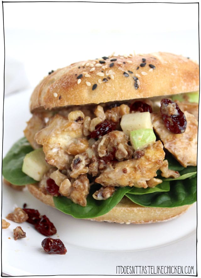 Hearty Vegan Tofu Salad Sandwich! With granny smith apple, dried cranberries, walnuts, and baked tofu bites mixed with vegan mayonnaise and dijon mustard. The perfect make-ahead sandwich for work or school. #itdoesnttastelikechicken #veganrecipes #tofu