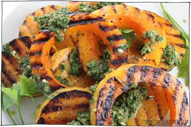 Grilled Butternut Squash with Chimichurri! Grilling squash brings out the flavours in a whole new way. A recipe that's quick and easy enough to make on a weeknight, but that happens to be gorgeous enough to look like the centerpiece for a holiday feast! #itdoesnttastelikechicken #veganrecipes #squash