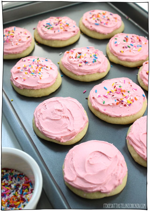 Vegan Soft Frosted Sugar Cookies: pillowy soft, cakey, frosted cookies- they are almost like the top of a cupcake that got smushed into a cookie complete with frosting and sprinkles! Decorate them for any occasion, birthdays, Christmas, Halloween, Thanksgiving, Valentine's day, weddings, baby showers. Egg free, dairy free, and pretty easy to make! #itdoesnttastelikechicken #veganrecipes #vegandesserts #vegancookies