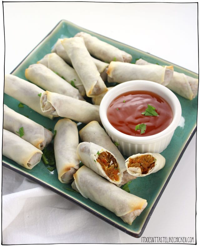Vegan Baked Spring Rolls! Guilt-free spring rolls! Baked instead of fried means these spring rolls are a healthier alternative. Easy to make, and can be made ahead of time and frozen. Perfect appetizer for a party! Oil-free option. #itdoesnttastelikechicken #veganrecipes #veganappetizer