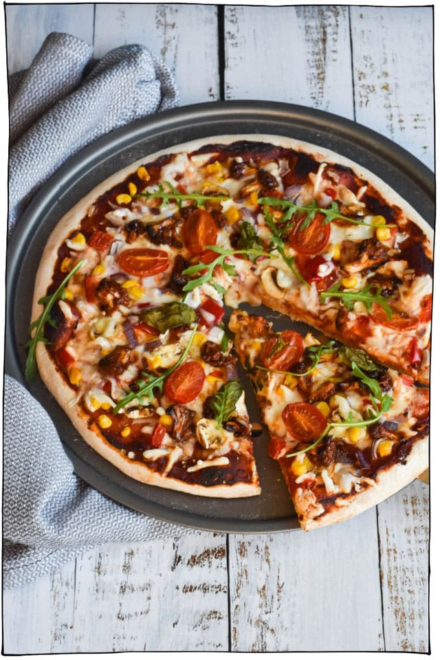 The Best Vegan Pizza Recipes! Whether you prefer classic toppings such as melty vegan cheeses, tomato sauces, basil, and pepperoni or you're into more adventurous pizza toppings like nacho pizza, coconut pizza, jalapeno popper pizza, and breakfast pizza, I've got the best vegan pizza recipes on the net for you right here. #itdoesnttastelikechicken #veganrecipes #veganpizza