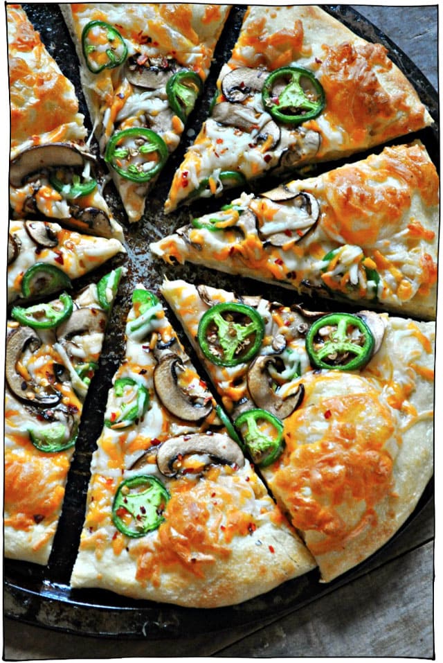 The Best Vegan Pizza Recipes! Whether you prefer classic toppings such as melty vegan cheeses, tomato sauces, basil, and pepperoni or you're into more adventurous pizza toppings like nacho pizza, coconut pizza, jalapeno popper pizza, and breakfast pizza, I've got the best vegan pizza recipes on the net for you right here. #itdoesnttastelikechicken #veganrecipes #veganpizza
