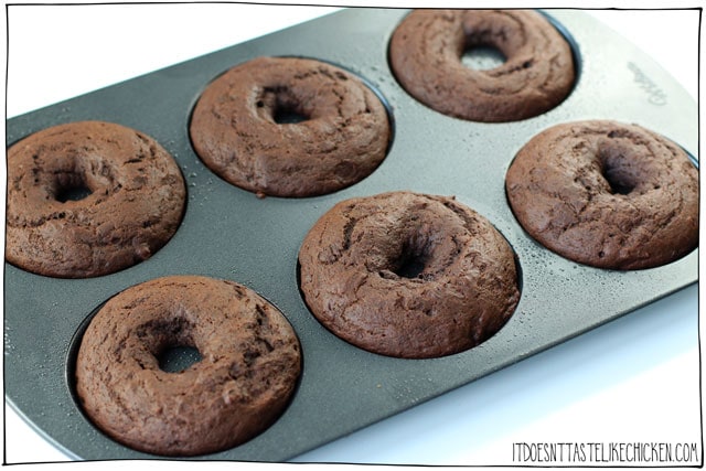 Vegan Double Chocolate Donuts! The best baked chocolate donuts recipe that take only 30 minutes to make. Top your chocolate donuts with sprinkles, chopped nuts, or leave them plain. #itdoesnttastelikechicken #veganrecipes #vegandesserts #donuts
