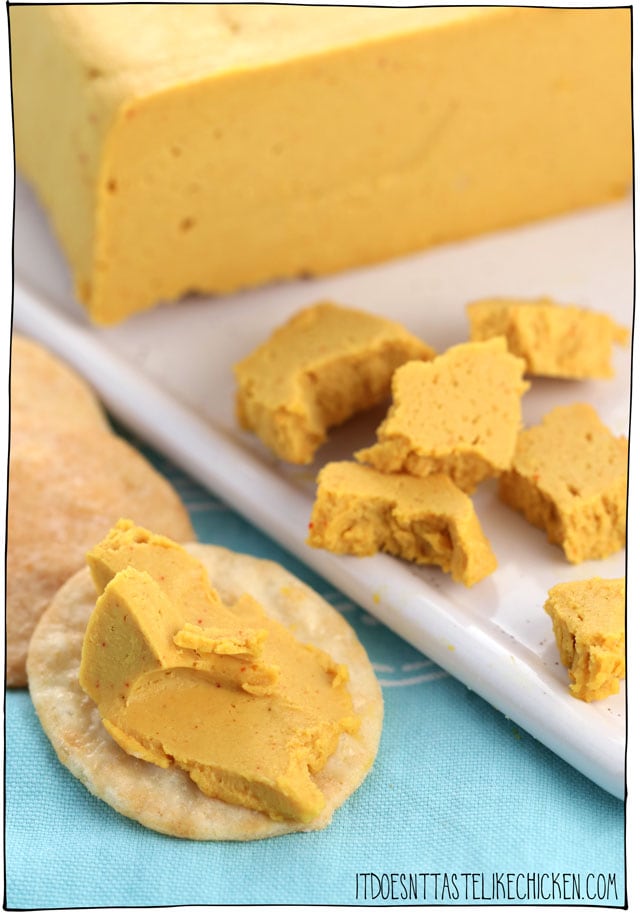 Vegan Sharp Cheddar Cheese! Just 9 easy ingredients and 15 minutes to make. So easy and totally delicious. Perfect for snacking, serving on a vegan cheese board, or adding to sandwiches. #itdoesnttastelikechicken #veganrecipes #vegancheese #dairyfree