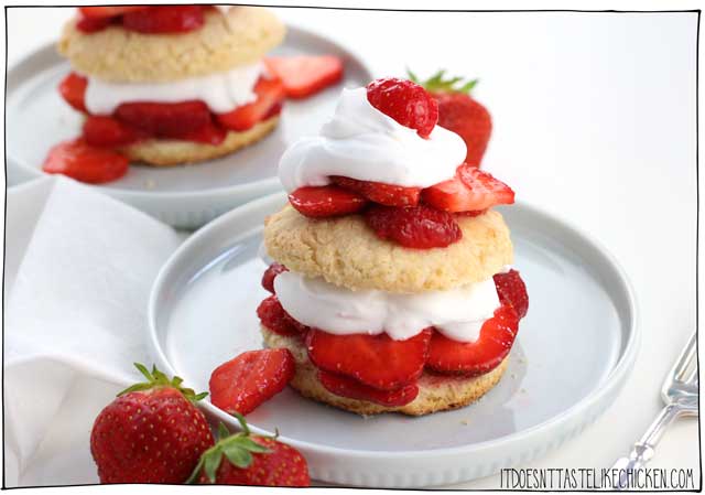 Vegan Strawberry Shortcakes! Easy to make, and can even be prepared ahead of time. Fresh juicy strawberries with a cloud of coconut cream layered between homemade vegan shortcakes. The perfect summer dessert. #itdoesnttastelikechicken #vegandessert #vegan