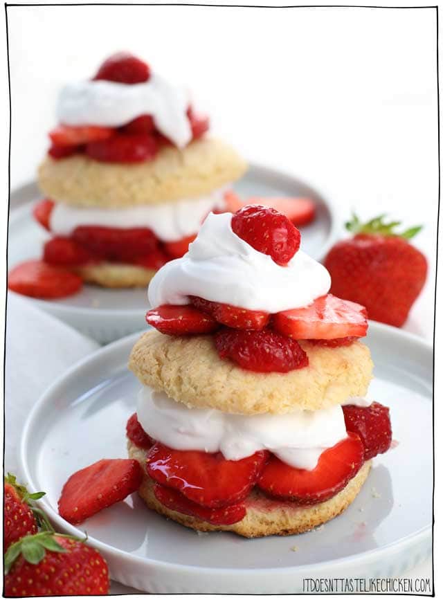 Vegan Strawberry Shortcakes! Easy to make, and can even be prepared ahead of time. Fresh juicy strawberries with a cloud of coconut cream layered between homemade vegan shortcakes. The perfect summer dessert. #itdoesnttastelikechicken #vegandessert #vegan