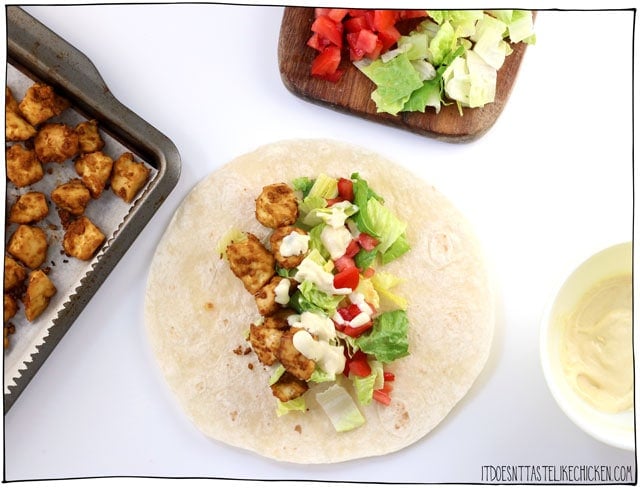 Vegan Tofu Caesar Wraps! You can make the tofu and dressing ahead of time so these wraps can be super quick to prepare, perfect for bringing to work, school, for an easy lunch or weeknight meal. Oil-free option #itdoesnttastelikechicken #veganrecipes #lunch