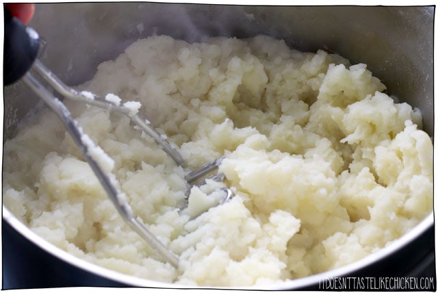 Mash the potatoes with the garlic and plant-based milk for the best mashed potatoes ever.