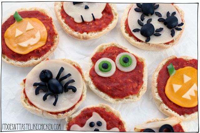 Vegan Mini Halloween Pizzas! Just 6 ingredients, 15 minutes baking time. Perfect for a spooky dinner appetizer idea, or snack. It's a fun activity to make with kids, and they're super yummy too! #itdoesnttastelikechicken #halloween #veganrecipes