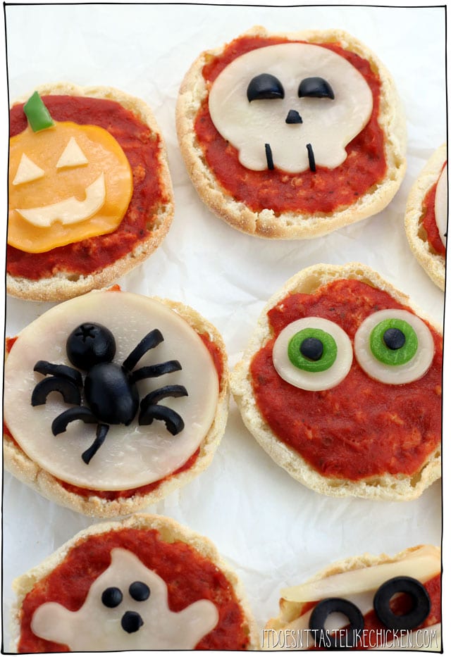 Vegan Mini Halloween Pizzas! Just 6 ingredients, 15 minutes baking time. Perfect for a spooky dinner appetizer idea, or snack. It's a fun activity to make with kids, and they're super yummy too! #itdoesnttastelikechicken #halloween #veganrecipes