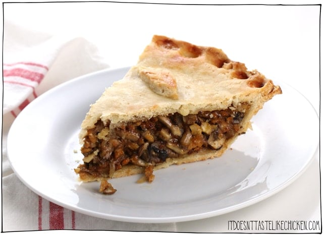 Vegan Tourtiere (vegan meat pie). This savoury pie is made with tofu and mushrooms for the best chewy, juicy, meaty texture. A fantastic centrepiece for Thanksgiving or Christmas. Make ahead. Gluten-free and oil-free options. #itdoesnttastelikechicken #veganrecipes 