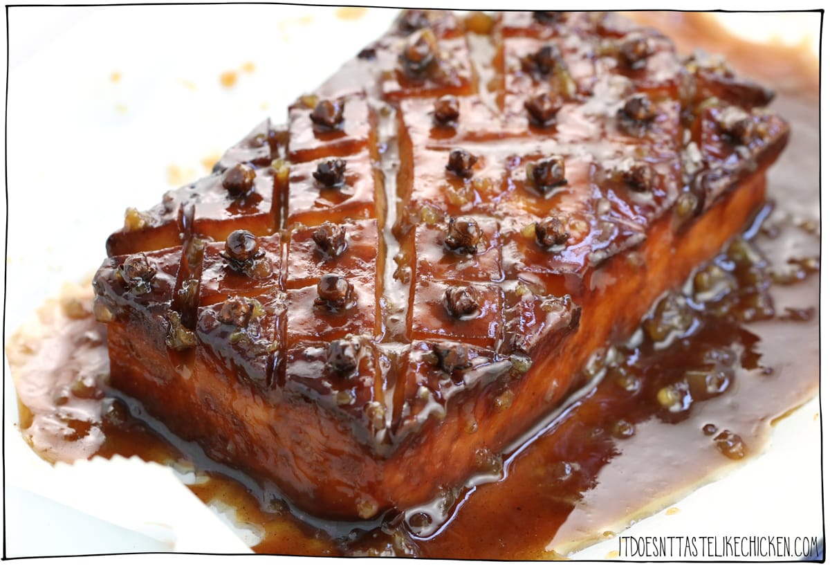 Brown Sugar & Mustard Glazed Tofu! Just 10 ingredients and easy to make. Inspired by glazed ham this tofu roast is the perfect centrepiece for Easter dinner or a holiday feast. #itdoesnttastelikechicken #veganrecipes #easterrecipe