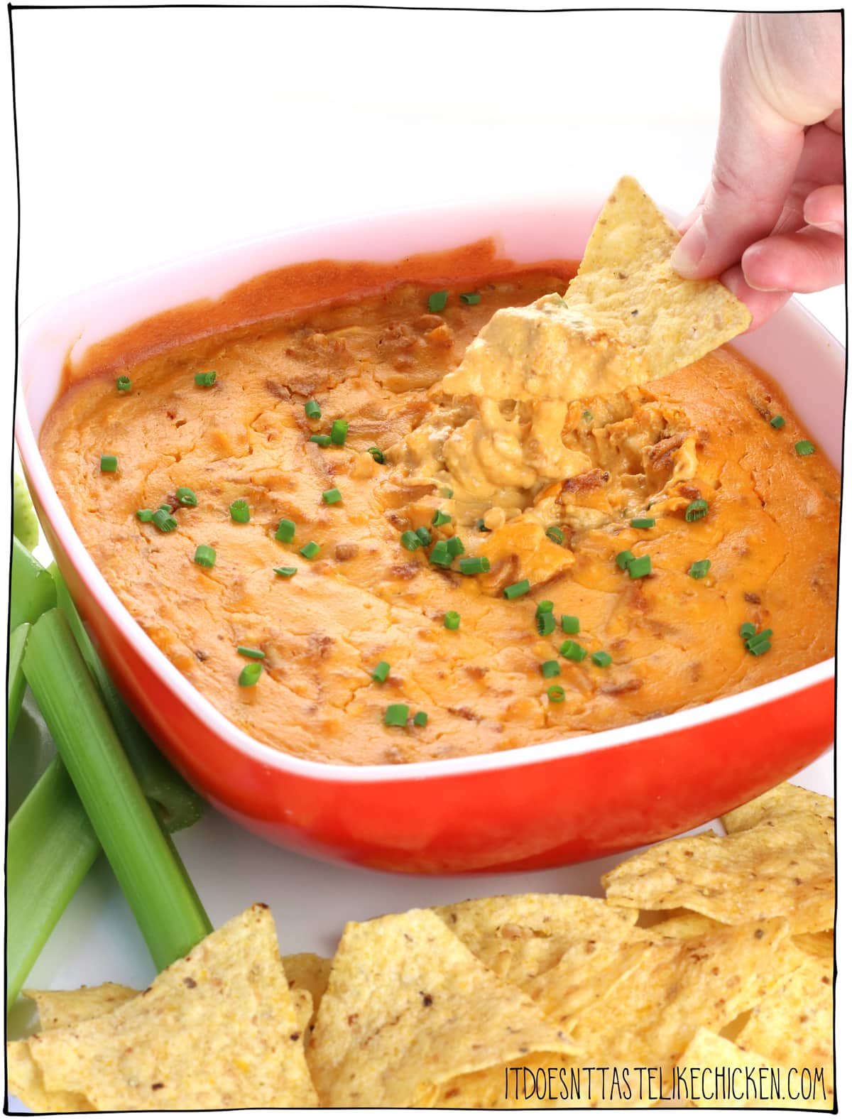 Vegan Buffalo Tofu Dip! This vegan buffalo chicken dip, tastes just like the classic, but better because it's easy to make, dairy-free, gluten-free, way healthier, make-ahead, and super delicious. Creamy, cheesy, spicy goodness perfect for any game day, BBQ, party, or movie night. #itdoesnttastelikechicken #veganrecipes