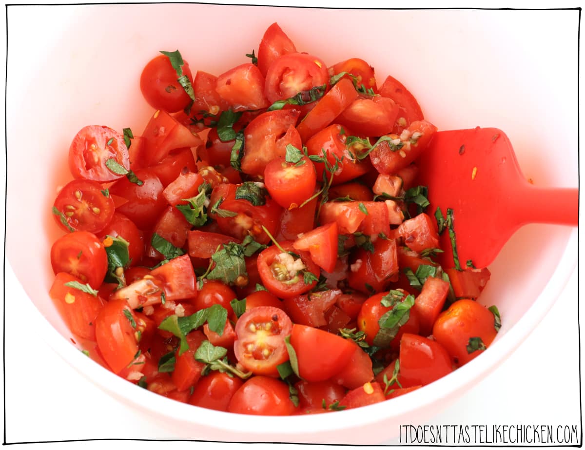 Add the tomatoes, fresh herbs, garlic, salt, and pepper to a large bowl and mix.