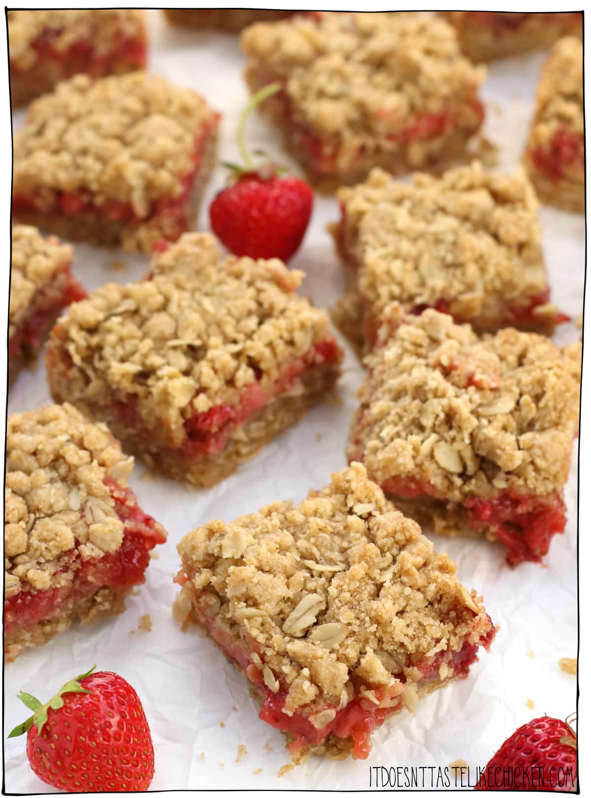 Vegan Strawberry Oat Bars! Sweet gooey strawberry filling surrounded by crumbly oatmeal cookie pastry, these old fashioned bars are summer dessert perfection! #itdoesnttastelikechicken #veganrecipe #vegandessert