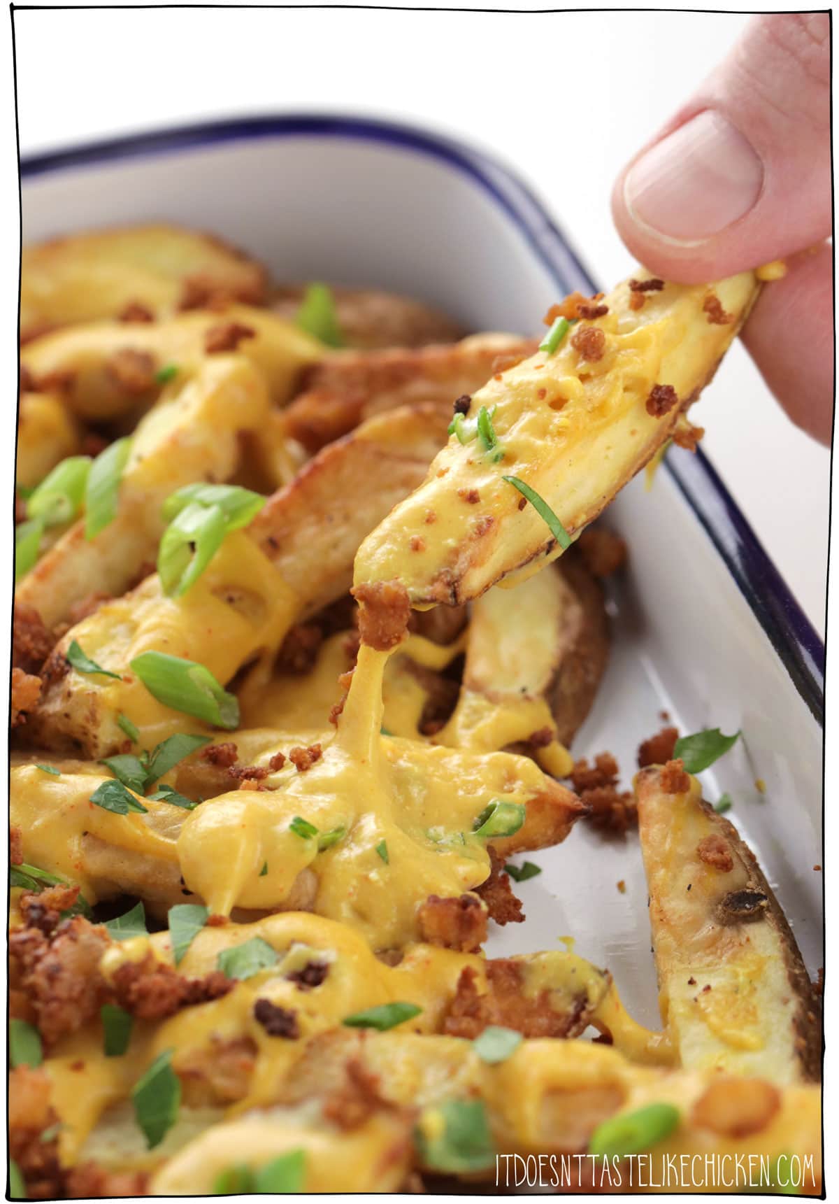 Easy Vegan Cheese Fries! Crispy french fries with homemade stretchy melty vegan nacho cheese, and tofu bacon bits. The perfect comfort food for movie night or game night. Surprisingly healthy and can even be made oil-free! #itdoesnttastelikechicken #veganrecipes #vegan