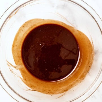 Melted chocolate and butter in glass bowl.