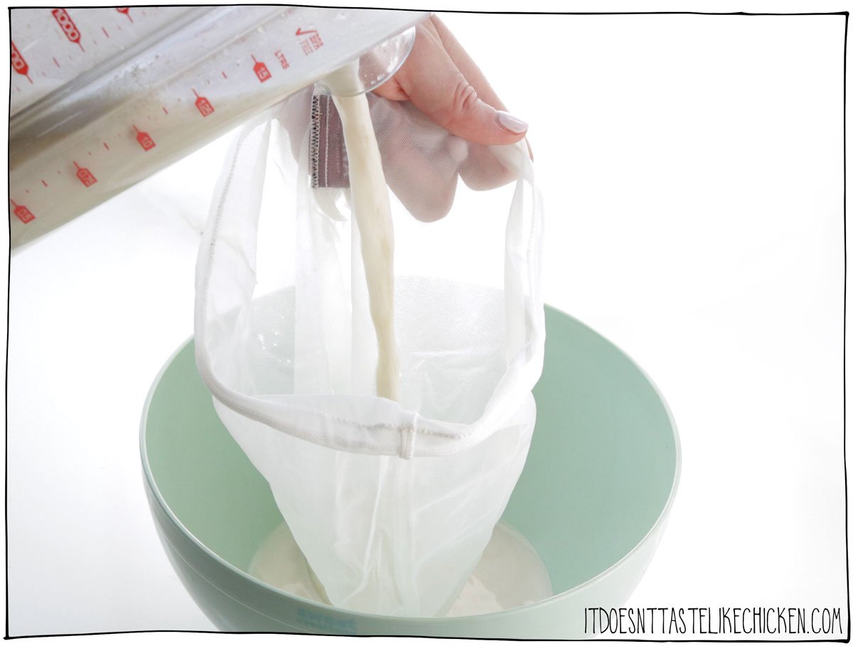 Pour through a nut milk bag