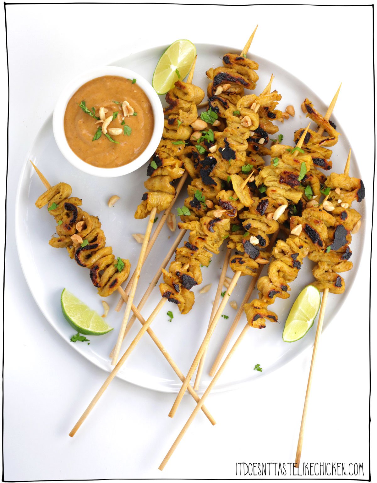 These vegan satay skewers are marinated in creamy coconut curry sauce, then grilled to perfection and served with spicy peanut sauce, and garnished with limes and chopped peanuts! Hello, deliciousness! These skewers are a super impressive appetizer or can be enjoyed as a main served with rice and veggies. #itdoesntastelikechicken #veganrecipes #soycurls