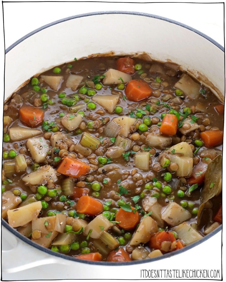 This Hearty Vegan Lentil Stew is full of warming stick-to-your-ribs flavors that are perfect for a chilly night. Packed with carrots, celery, potatoes, peas, and lentils this rich stew is full of good-for-you veggies, that are simmered in a hearty gravy sauce made with red wine. YUM. #itdoesnttastelikechicken #stew #veganrecipes
