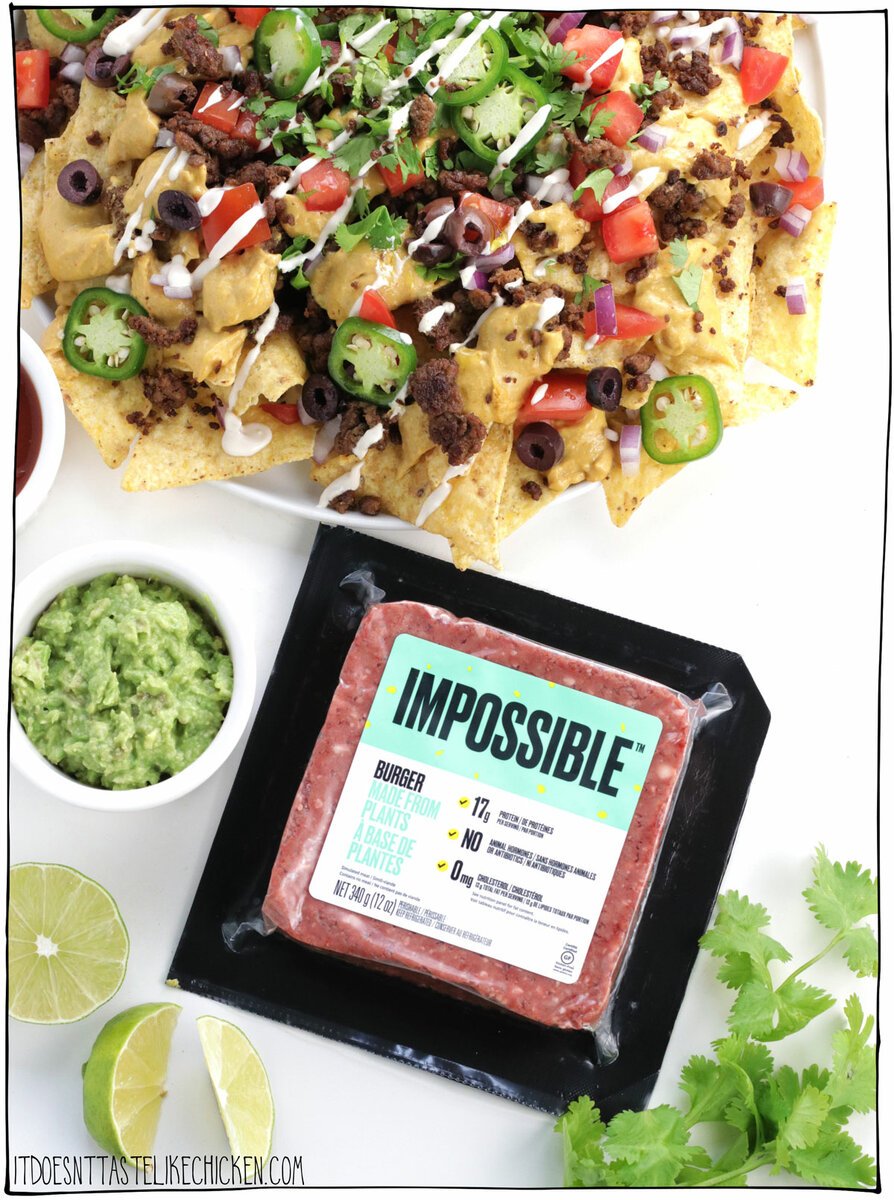The Best Loaded Vegan Nachos! Dive into the meatiest plant-based nachos you've ever had! Impossible™ Beef is crumbled, cooked, and seasoned with Mexican-inspired spices for the easiest and most delicious meaty topping. Then whip up a simple homemade plant-based nacho cheese and layer the cheese and meat on tortilla chips. Pile on all your favorite toppings to make The Best Loaded Nachos! YUM. #itdoesnttastelikechicken #vegan #sponsored