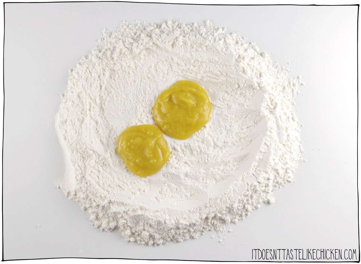 On a clean work surface, make a well in your flour and add your vegan egg yolk