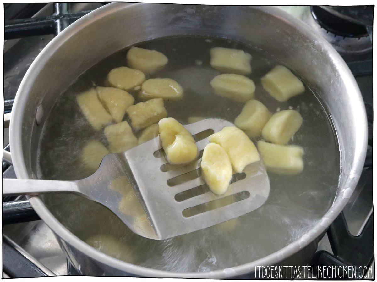 Boil the homemade vegan gnocchi for a few minutes until they float.